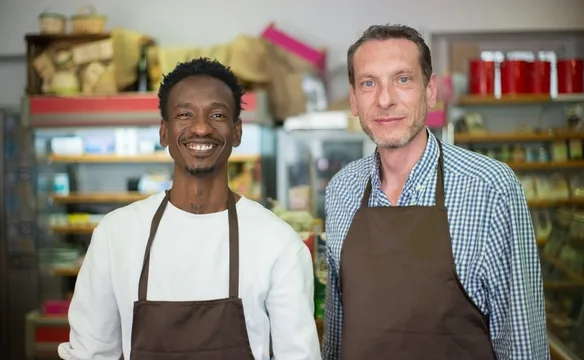 Two small business owners in their store
